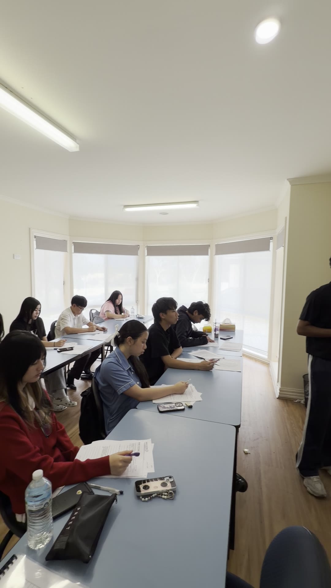 Signal Education students working through class work in a bright classroom